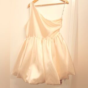 Aureta Studio Kyla One Shoulder Bubble Hem Mini Dress in soft ivory.